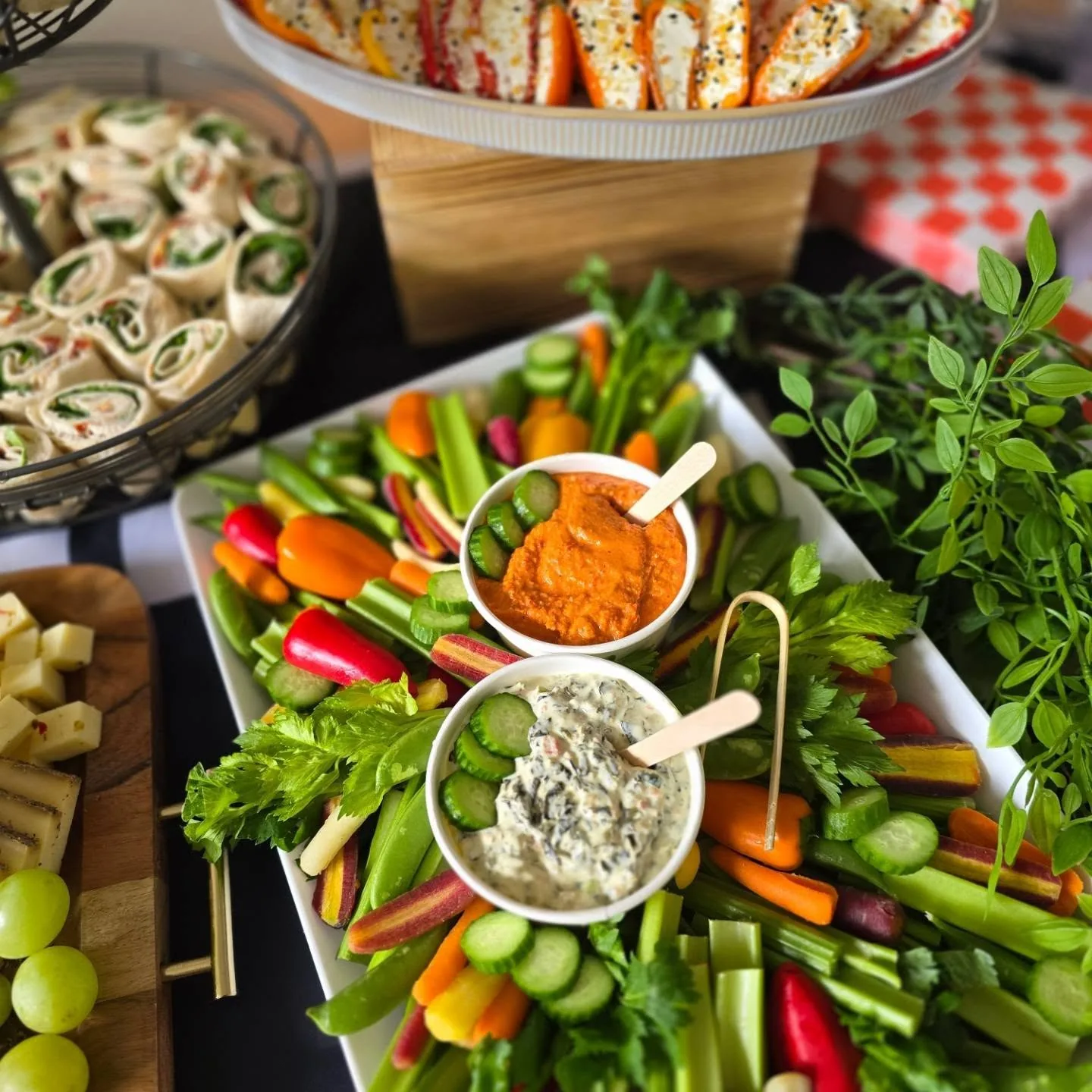 Fresh veggie crudité platter with red pepper and spinach dips